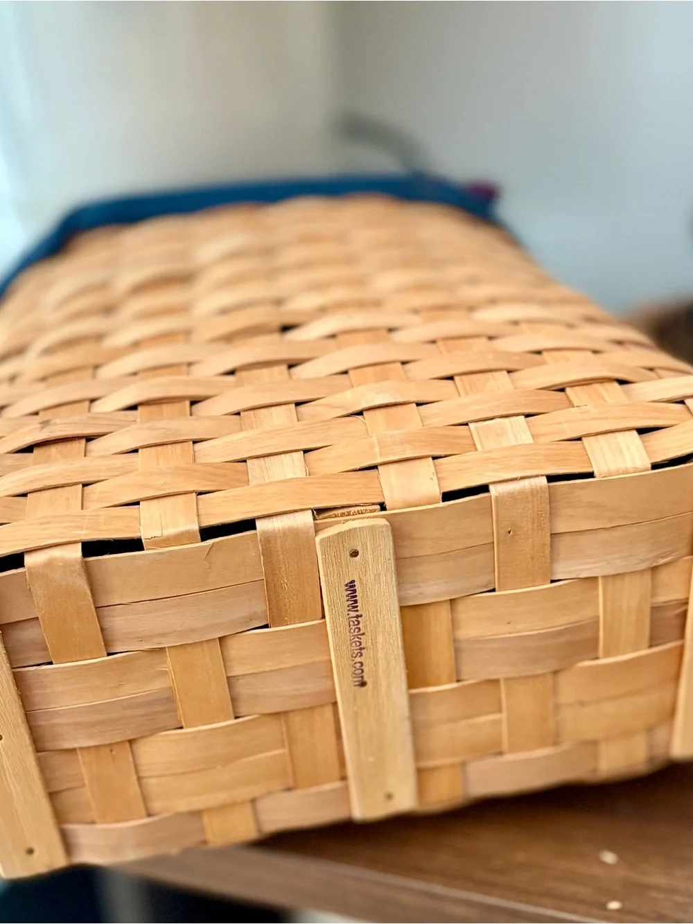 Natural Wicker Basket with Navy Fabric Trim and faux leather handles